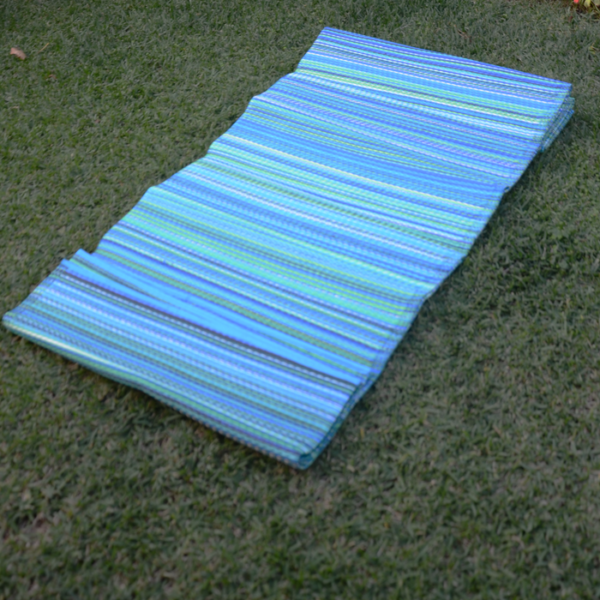 Cancun Aqua Rug 270x270cm displayed outside on the grass