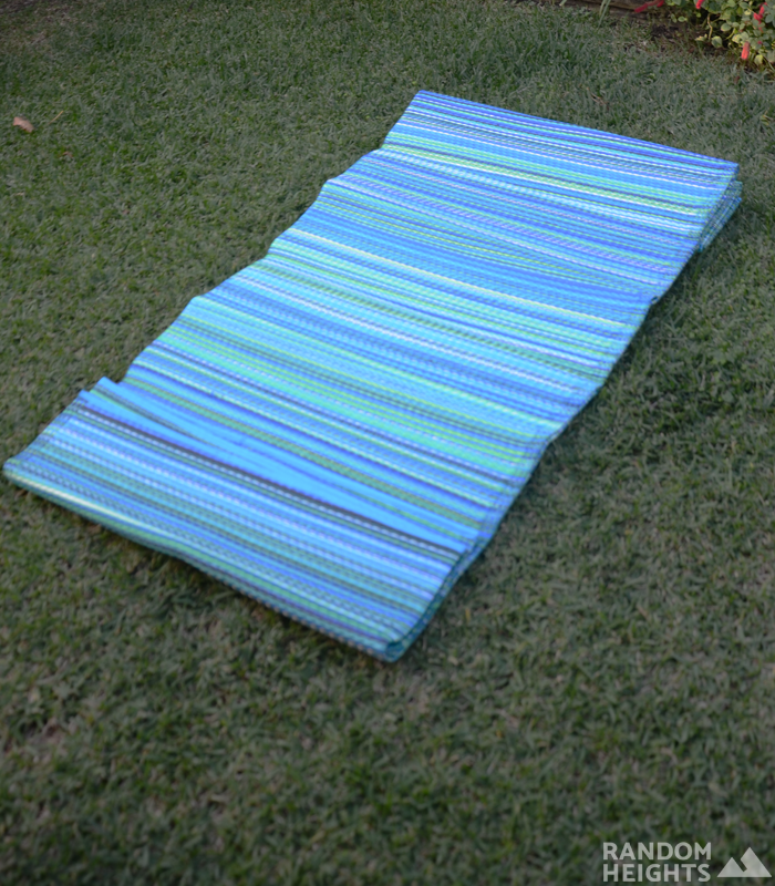 Cancun Aqua Rug 270x270cm displayed outside on the grass