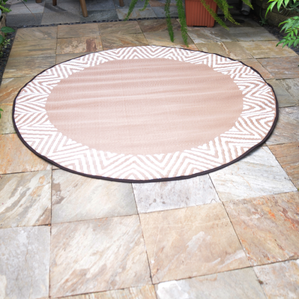 round beige rug outdoors