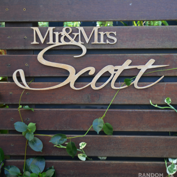 Wedding Sign Mr&Mrs Scott displayed on slats of wood in the garden