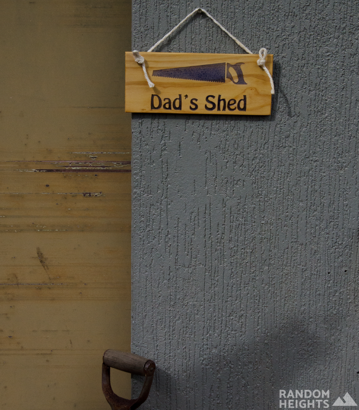 Wooden Dad's Shed Sign with rope on Dad's shed door
